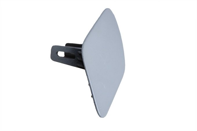 Zaślepka spryskiwacza reflektora lewego