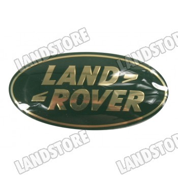 Logo "Land Rover" klamka drzwi tył (piąte) Discovery / Discovery II / Freelander / maskownica chłodnicy Discovery II / Discovery 3 / Freelander / RR P38 / RR L322 do 2009 (VIN:9A999999) / RR Sport do 2009 (VIN:9A999999) (złote)