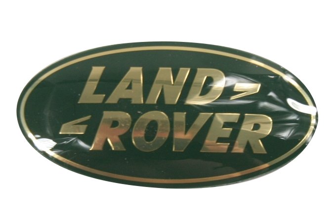 Logo "Land Rover" klamka drzwi tył (piąte) Discovery / Discovery II / Freelander / maskownica chłodnicy Discovery II / Discovery 3 / Freelander / RR P38 / RR L322 do 2009 (VIN:9A999999) / RR Sport do 2009 (VIN:9A999999) (złote)