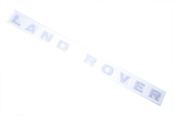 Naklejka "LAND ROVER" pokrywy silnika Discovery II do 2003 (Gunsmoke Silver)